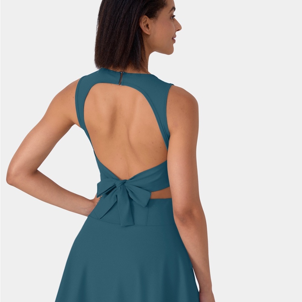 HALARA sleeveless cutout tennis dress.